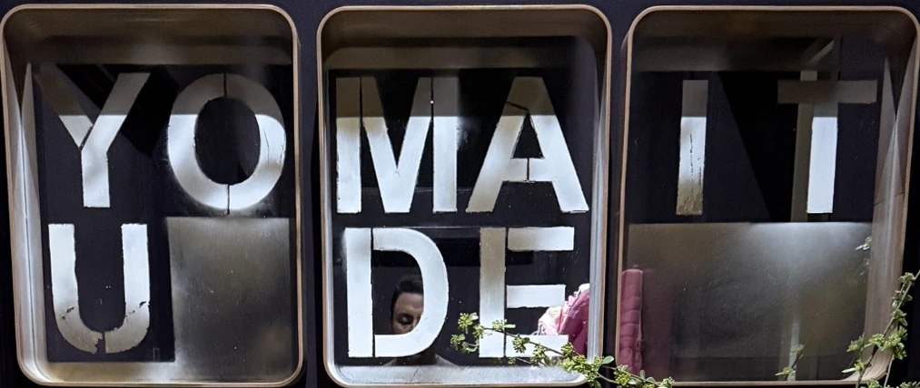 Three black and metallic panels reading YOU MADE IT
